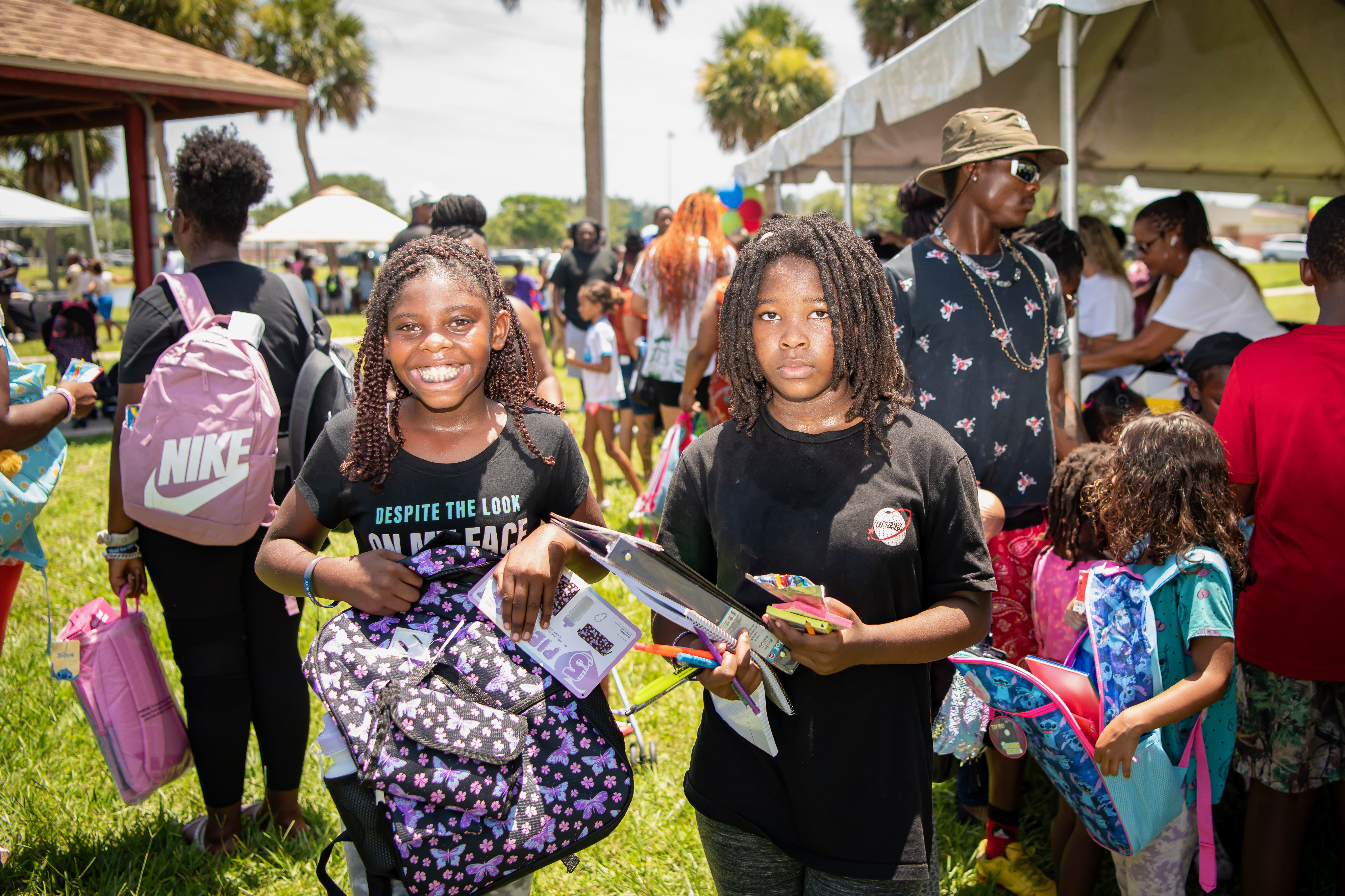 Kids with backpacks and school supplies